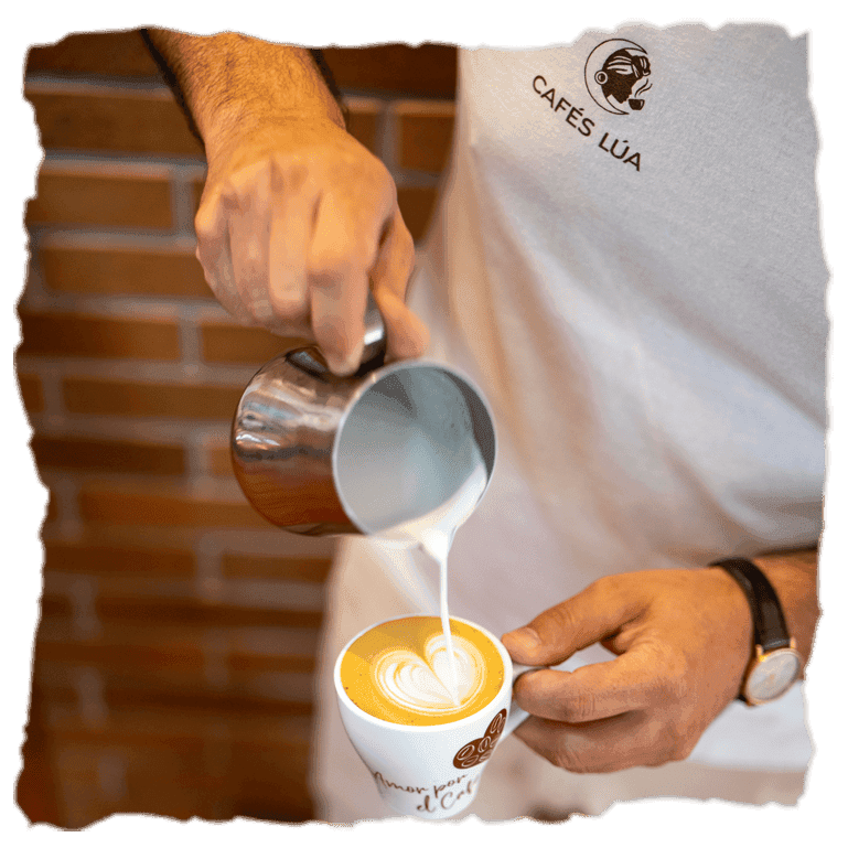 un barista sirve una taza de café