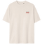 Parte delantera de la camiseta blanca con el logo de cervezas 1906 en el pecho y el lema para una inmensa minoría, para lucir un estilo cervecero.