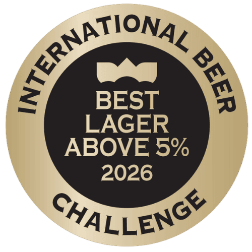 Sello del premio a la cerveza 1906 Black Coupage de The International Beer Challenge 2026 Trophy - Best Lager above 5%.