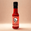 botella de 100 ml de Salsa Arredemo de A Factoría do Lume, con una mezcla de chiles fermentados que esconde pimientos fantasma con un picante potente que se revela gradualmente en el paladar.